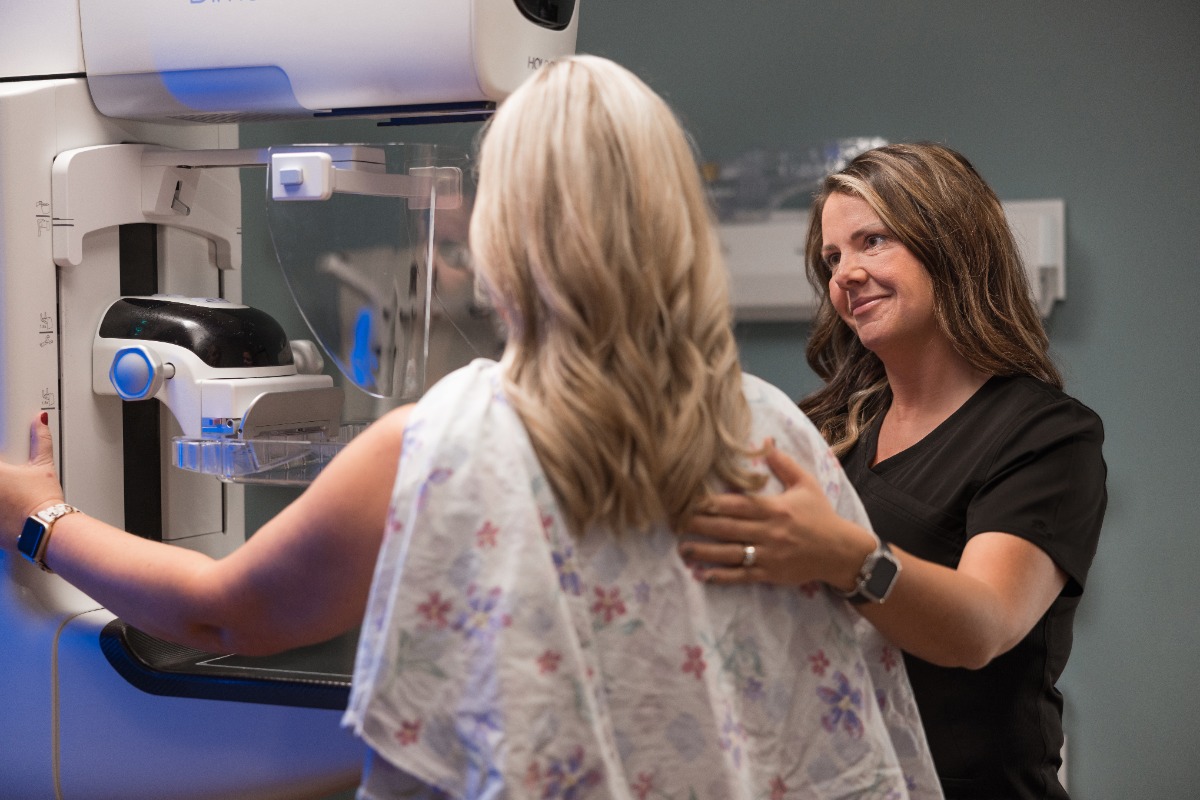 A women getting a mammography done, during breast cancer awareness month.
