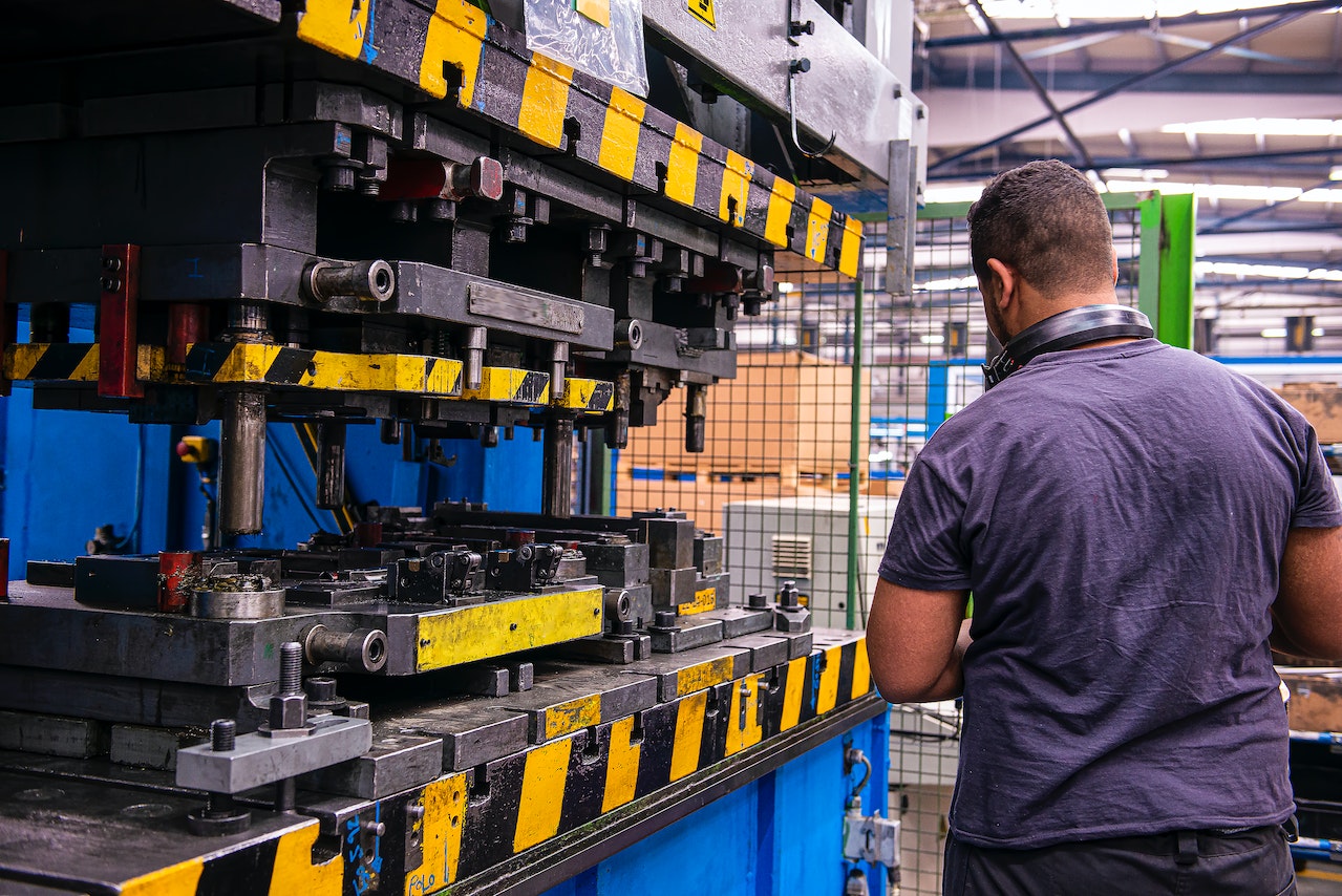 Man working on machine in factory