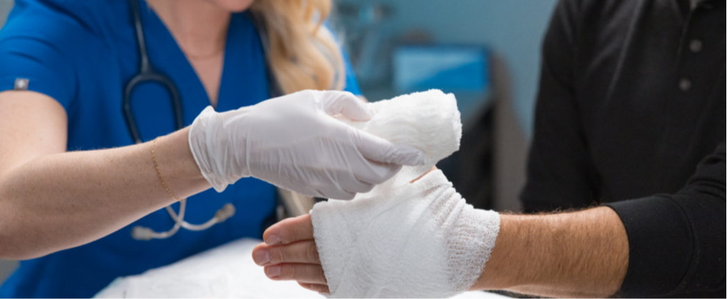 stock-photo-smiling-elderly-patient-grateful-for-help-of-a-doctor-in-white-uniform-fixing-his-hand-768825655
