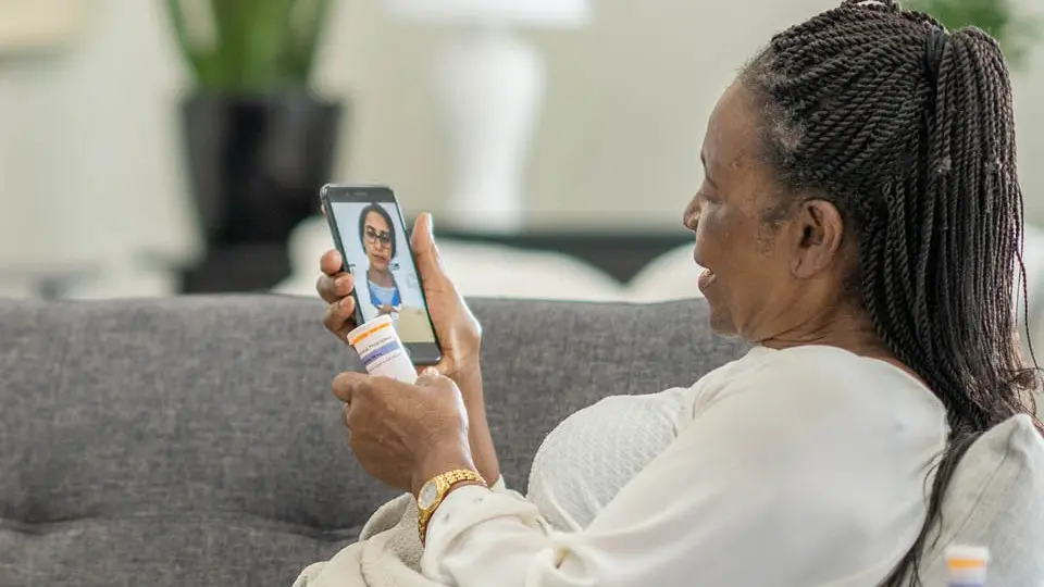 A patient doing a virtual visit with her primary care doctor