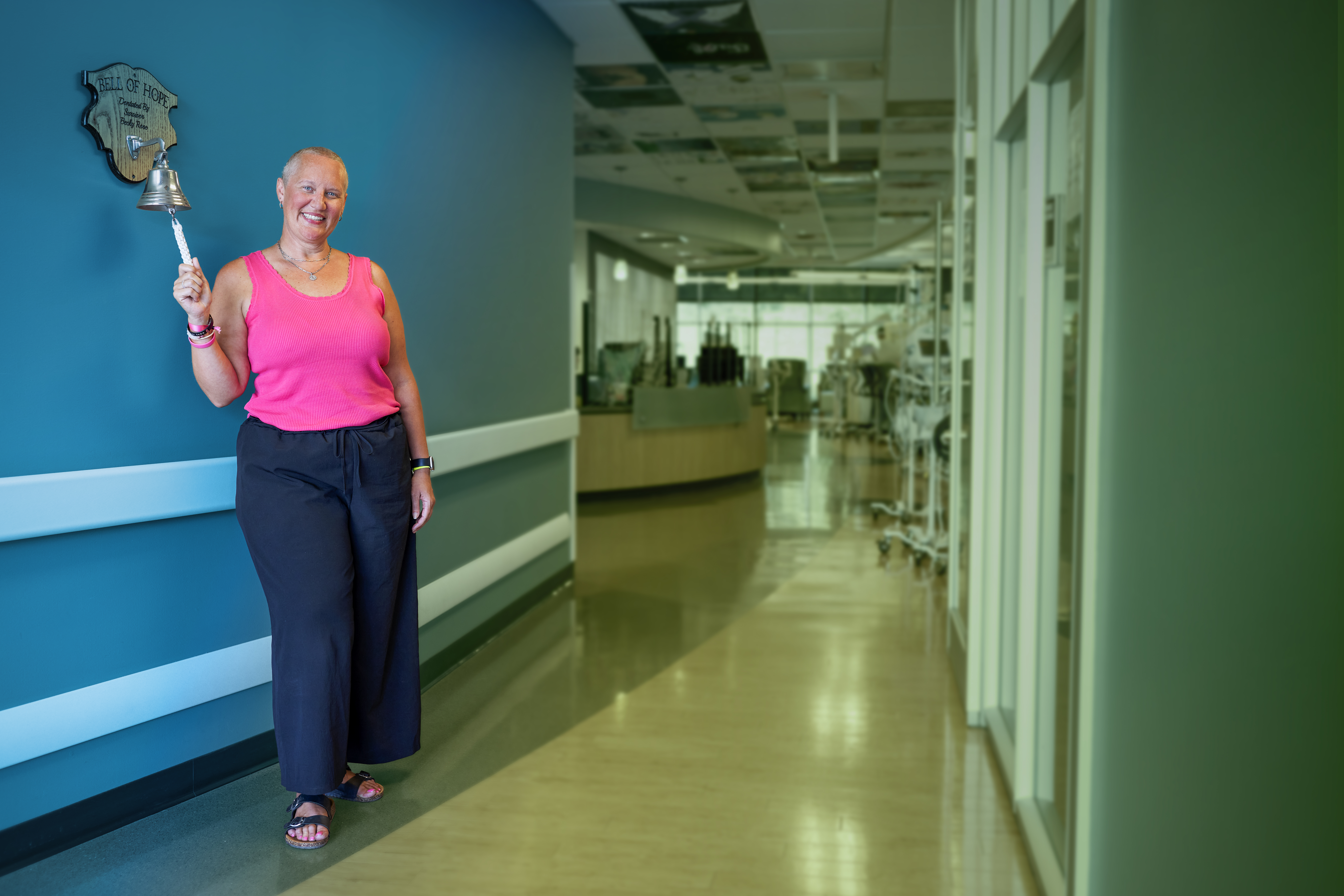 Emily Wood ringing the bell after beating cancer.
