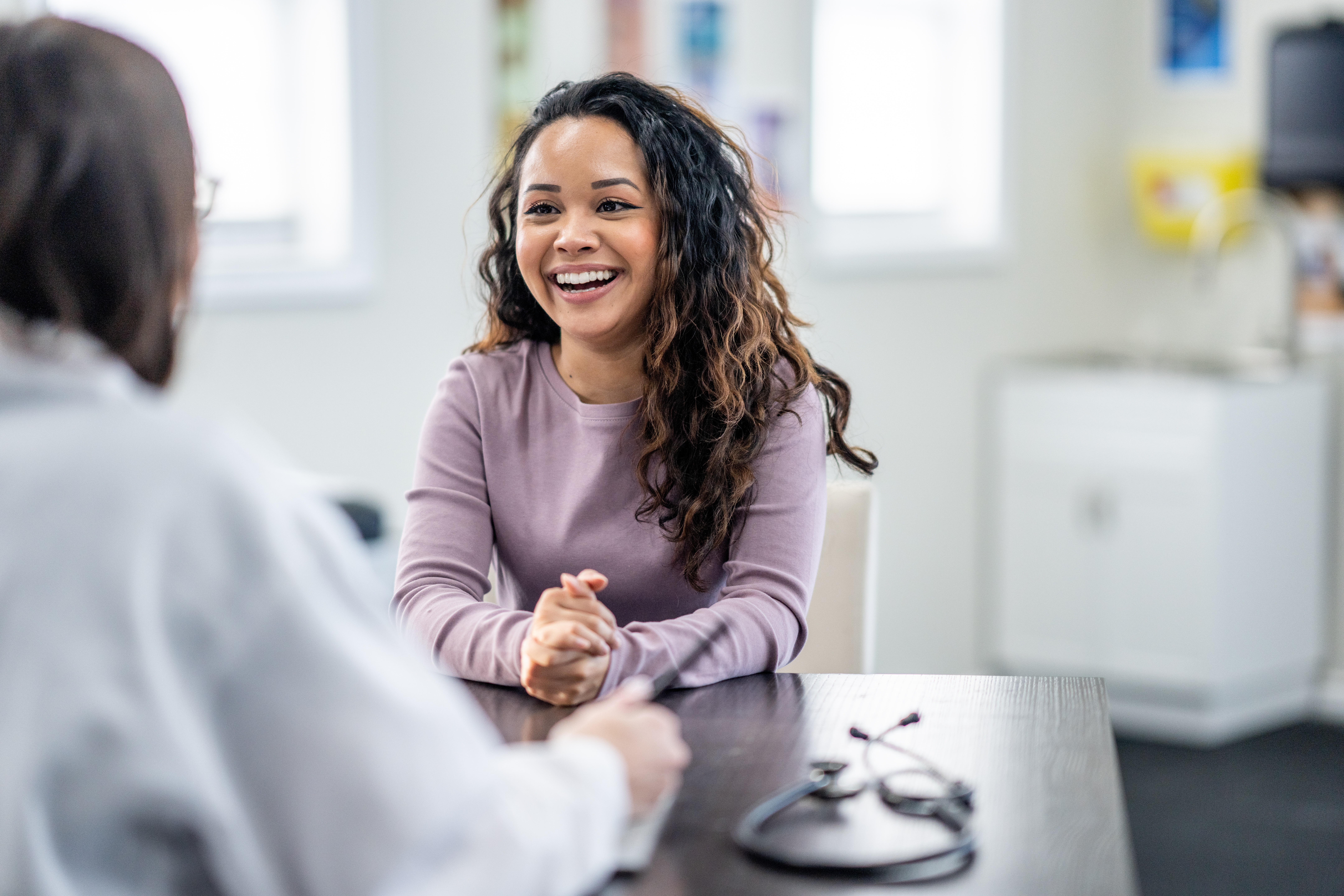 A women on a health visit with her primary care doctor.