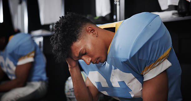 A high school football player showing concussion signs.