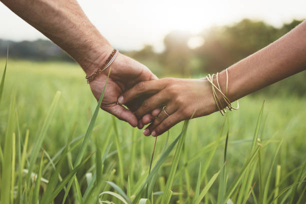 To people holding hands. This is to signal giving in relation to this article.
