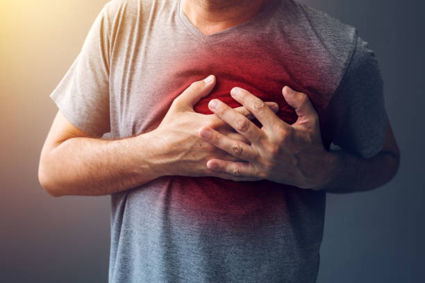 A stock graphic of a man holding his heart, as if he is having a heart attack.