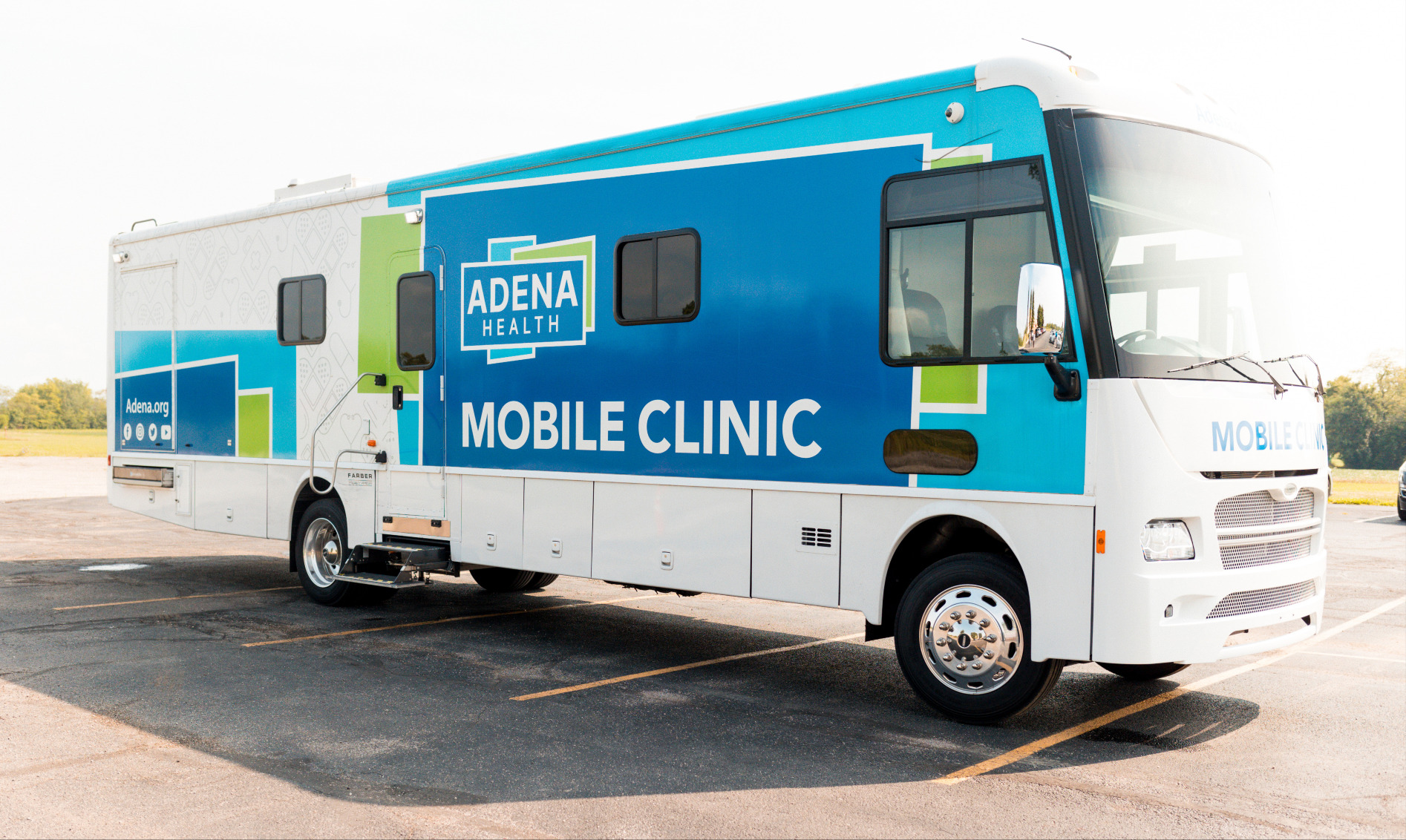 Adena Health mobile clinic bus parked in an open lot, offering accessible healthcare services throughout southern Ohio.