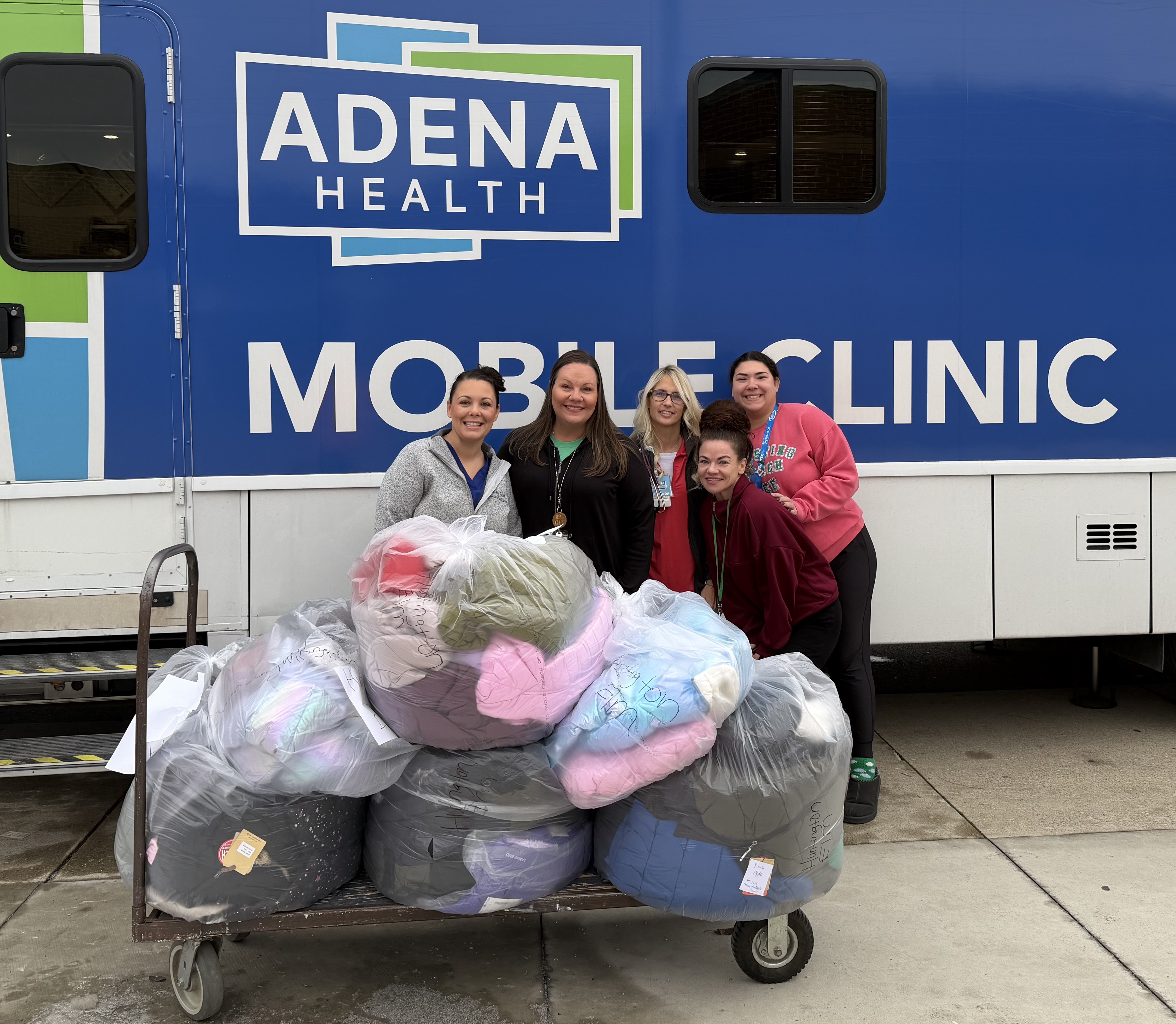 Adena Health caregivers delivering coats to local schools