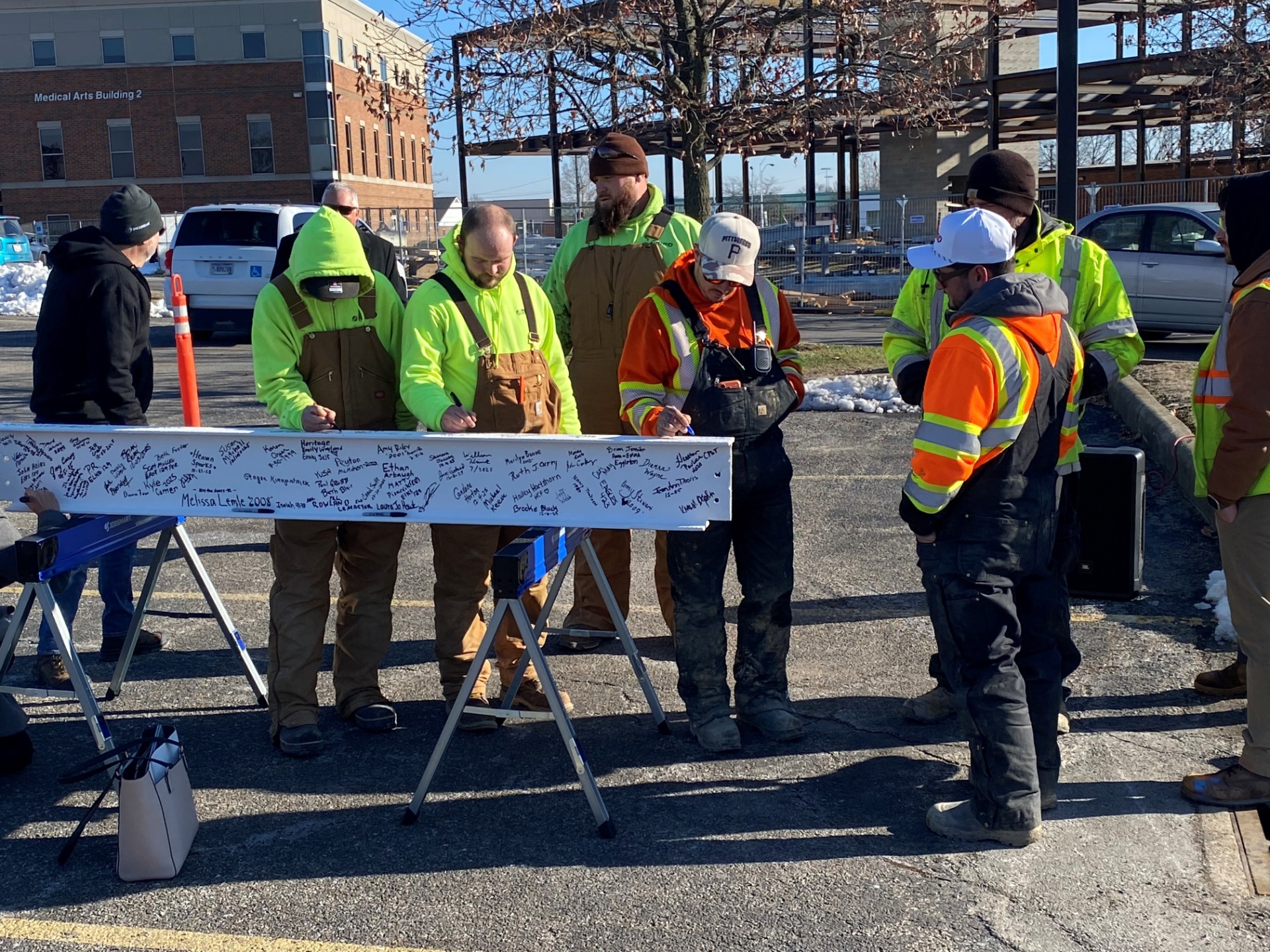 construction crew signing beam