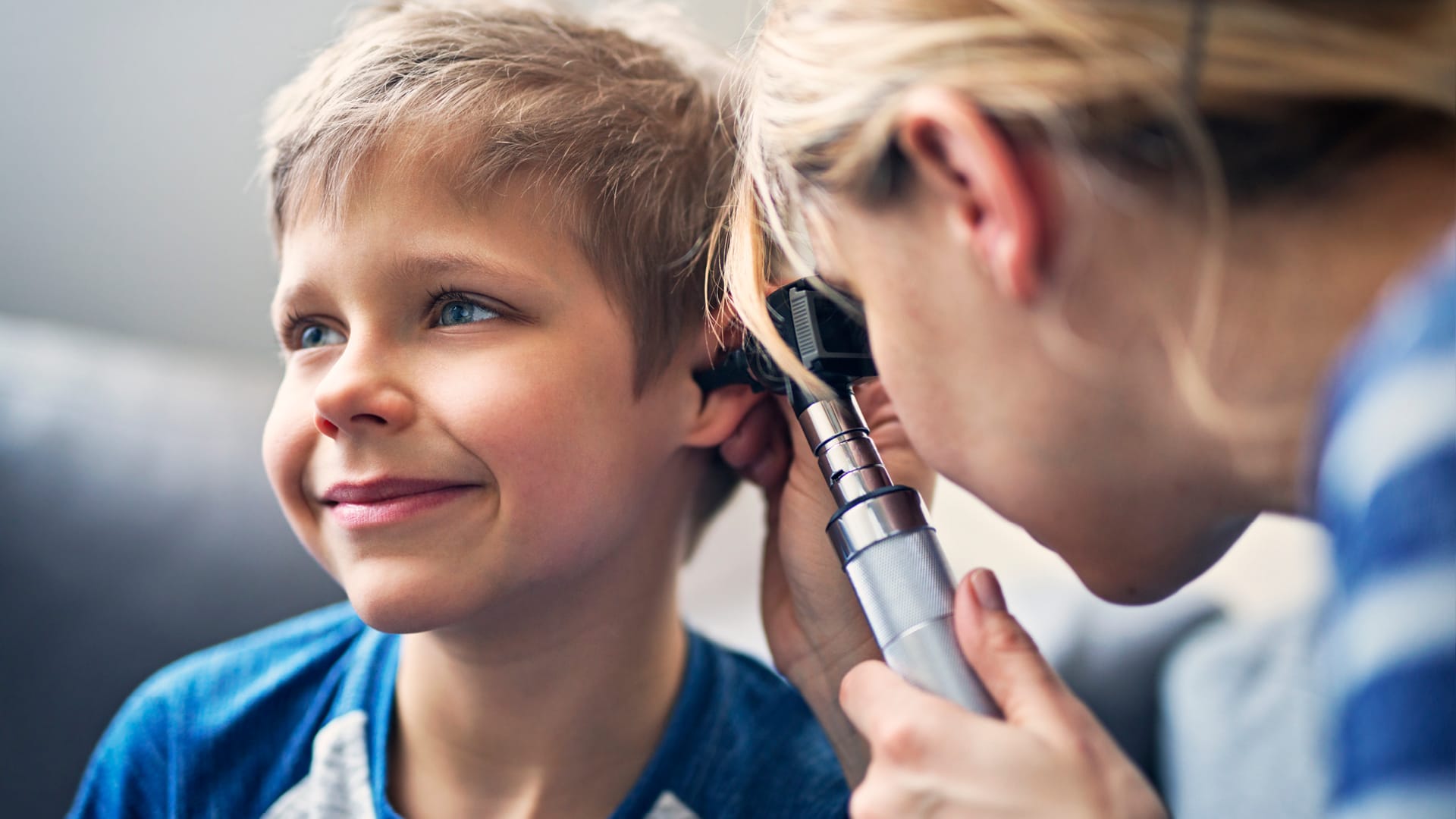 Young boy getting his ears checked.