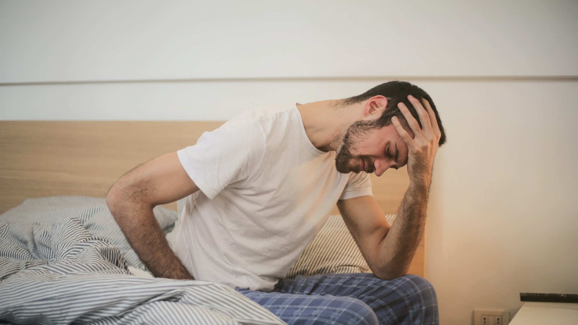 Man waking up needing urgent care Man waking up needing urgent care
